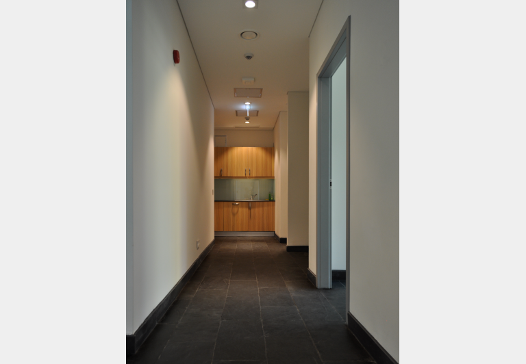 Hallway and kitchenette with granite floors